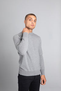 Model wearing The Merino Wool Sweater Light Grey Melange , front - Unborn