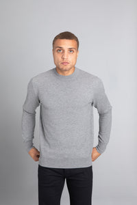 Model wearing The Merino Wool Sweater Light Grey Melange , front - Unborn