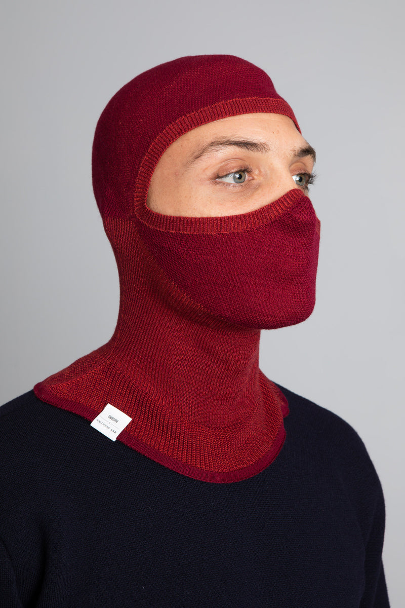 Model wearing The Merino Balaclava Brick Red from Unborn