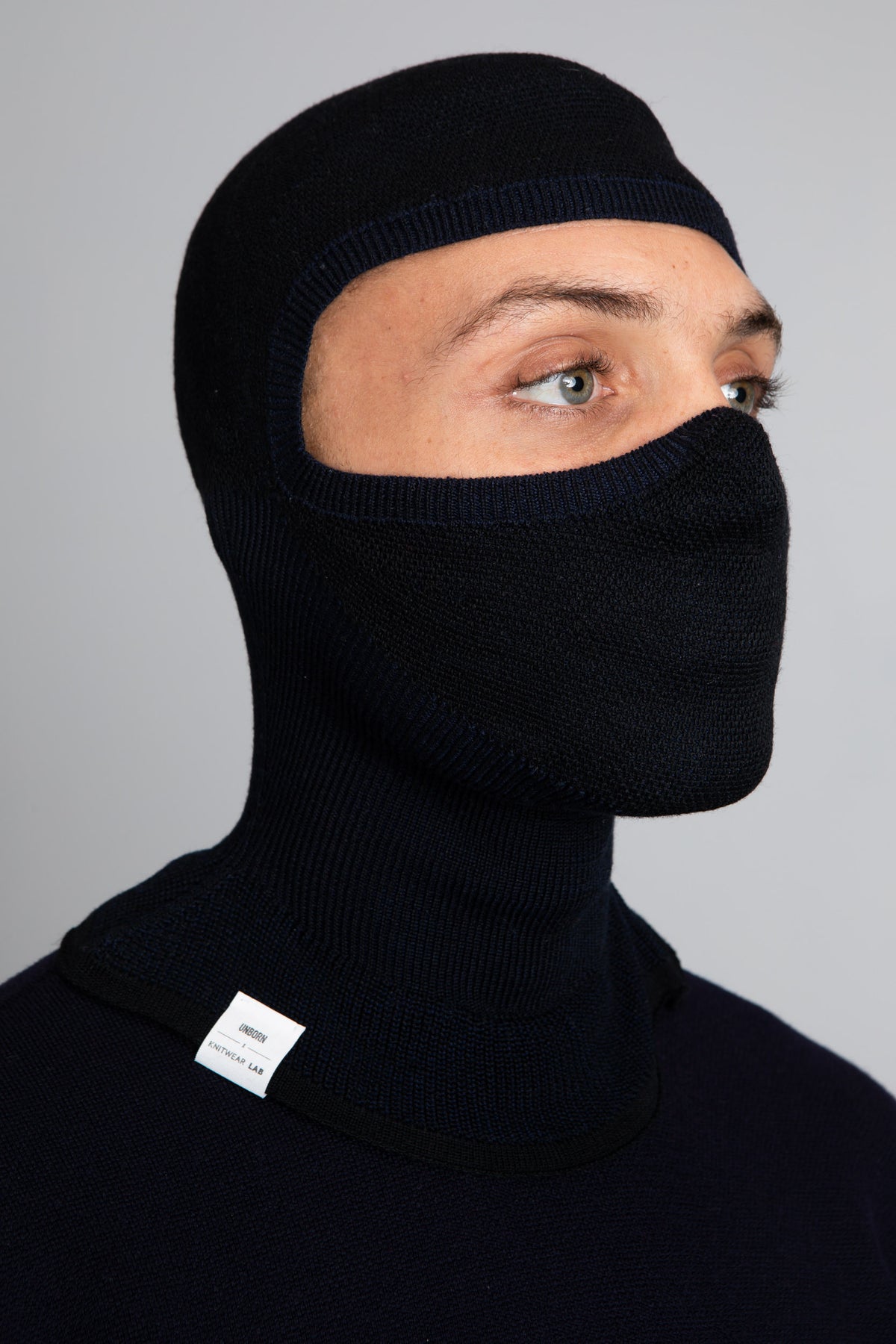 Front view model wearing the Merino Balaclava in Navy