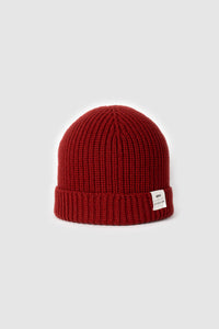 The Merino wool beanie  brick red, front view Unborn