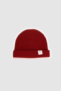 The Merino wool beanie  brick red, flat front view Unborn