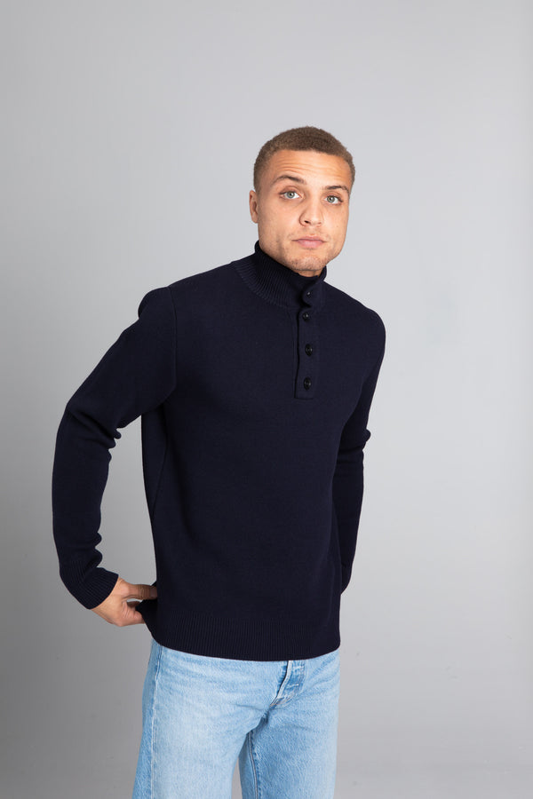 Model wearing the Merino wool Jacquard Button Up Navy, front view Unborn