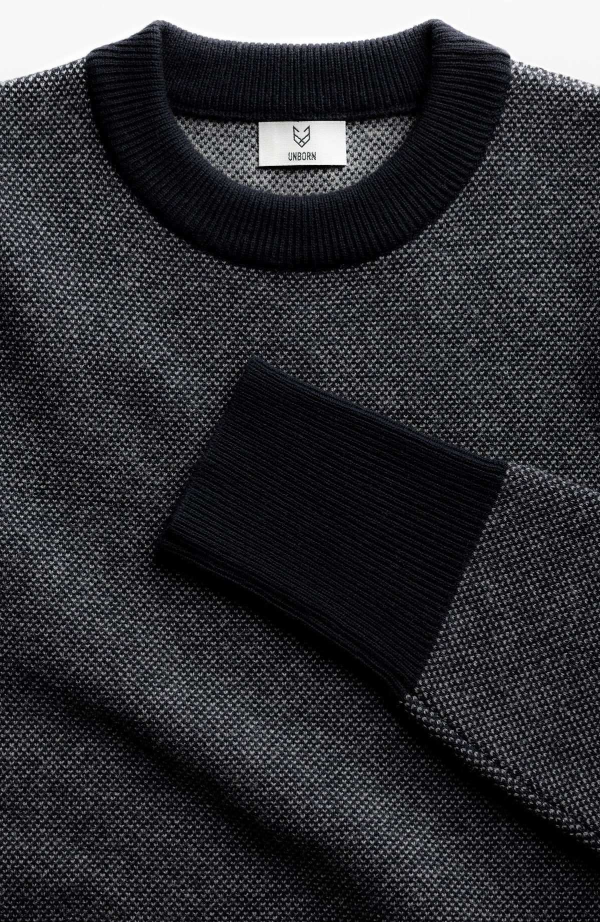 The Merino wool jaquard sweater Black Grey, close up front - Unborn