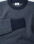 The Merino wool jaquard sweater Navy Grey, close up flat front - Unborn