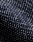 The Merino wool jaquard sweater Dark Navy Grey, close up fabric - Unborn