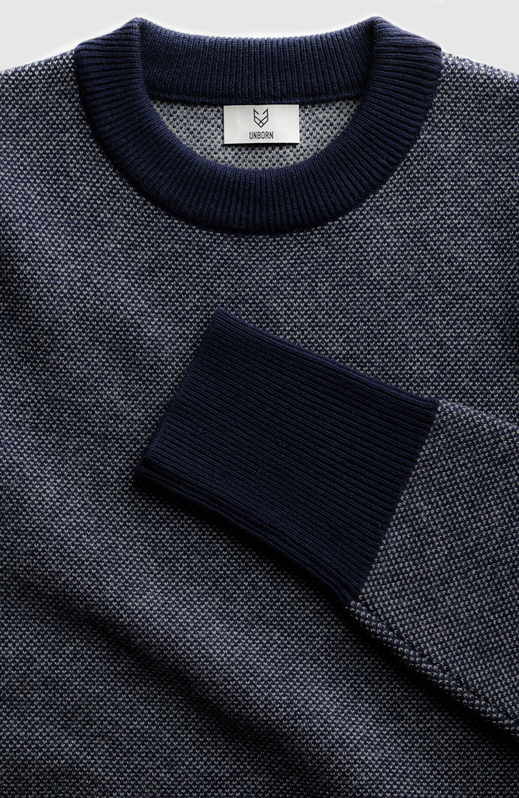 The Merino wool jaquard sweater Dark Navy Grey, Close up front - Unborn