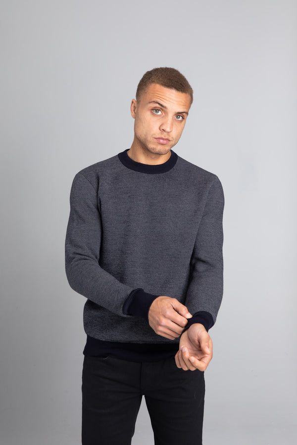 Model Wearing The Merino wool jaquard sweater Navy Grey, front - Unborn