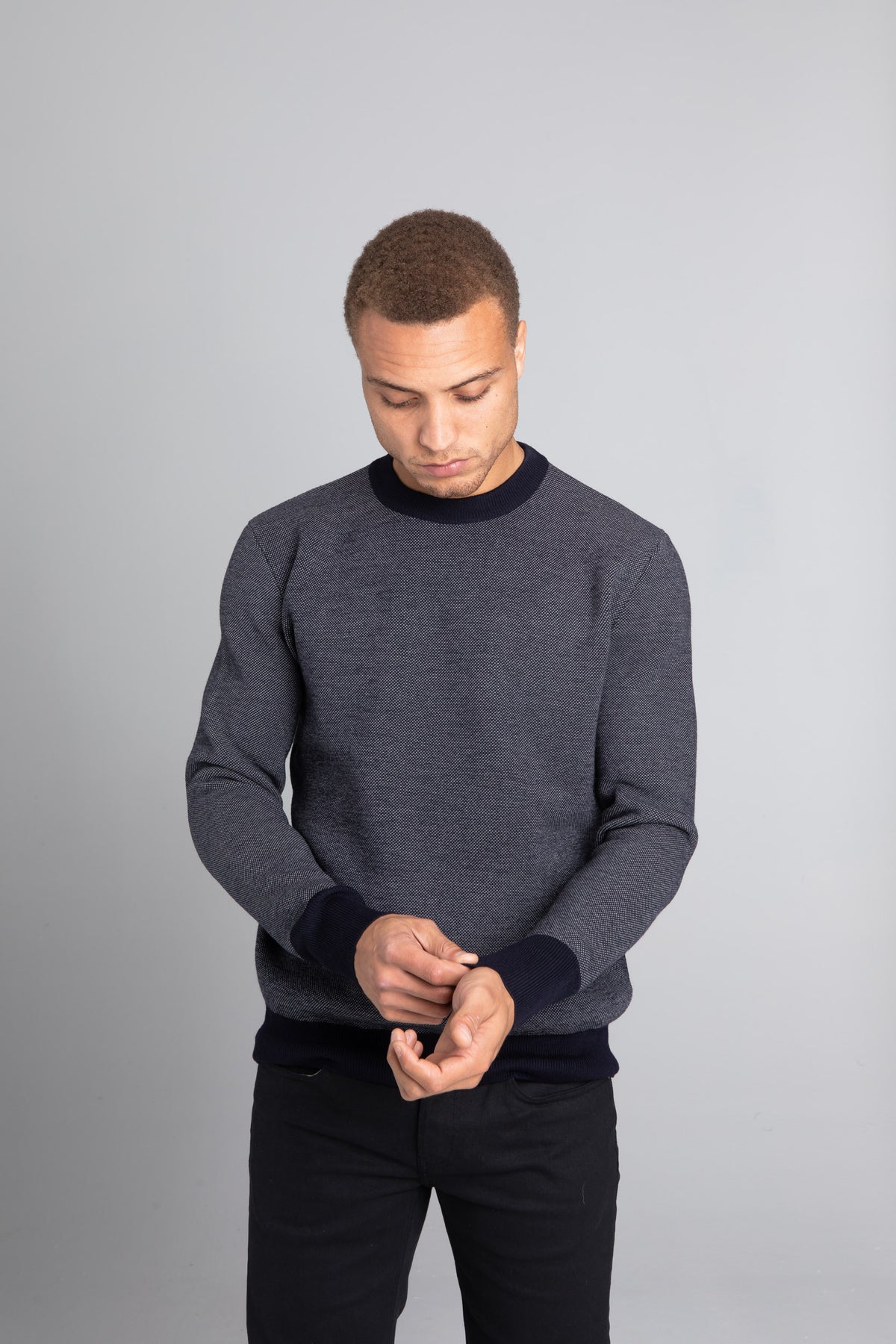 Model Wearing The Merino wool jaquard sweater Navy Grey, front - Unborn