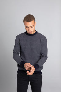 Model Wearing The Merino wool jaquard sweater Navy Grey, front - Unborn