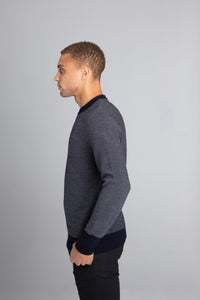 Model Wearing The Merino wool jaquard sweater Navy Grey, left - Unborn