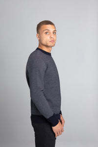 Model Wearing The Merino wool jaquard sweater Navy Grey, right - Unborn
