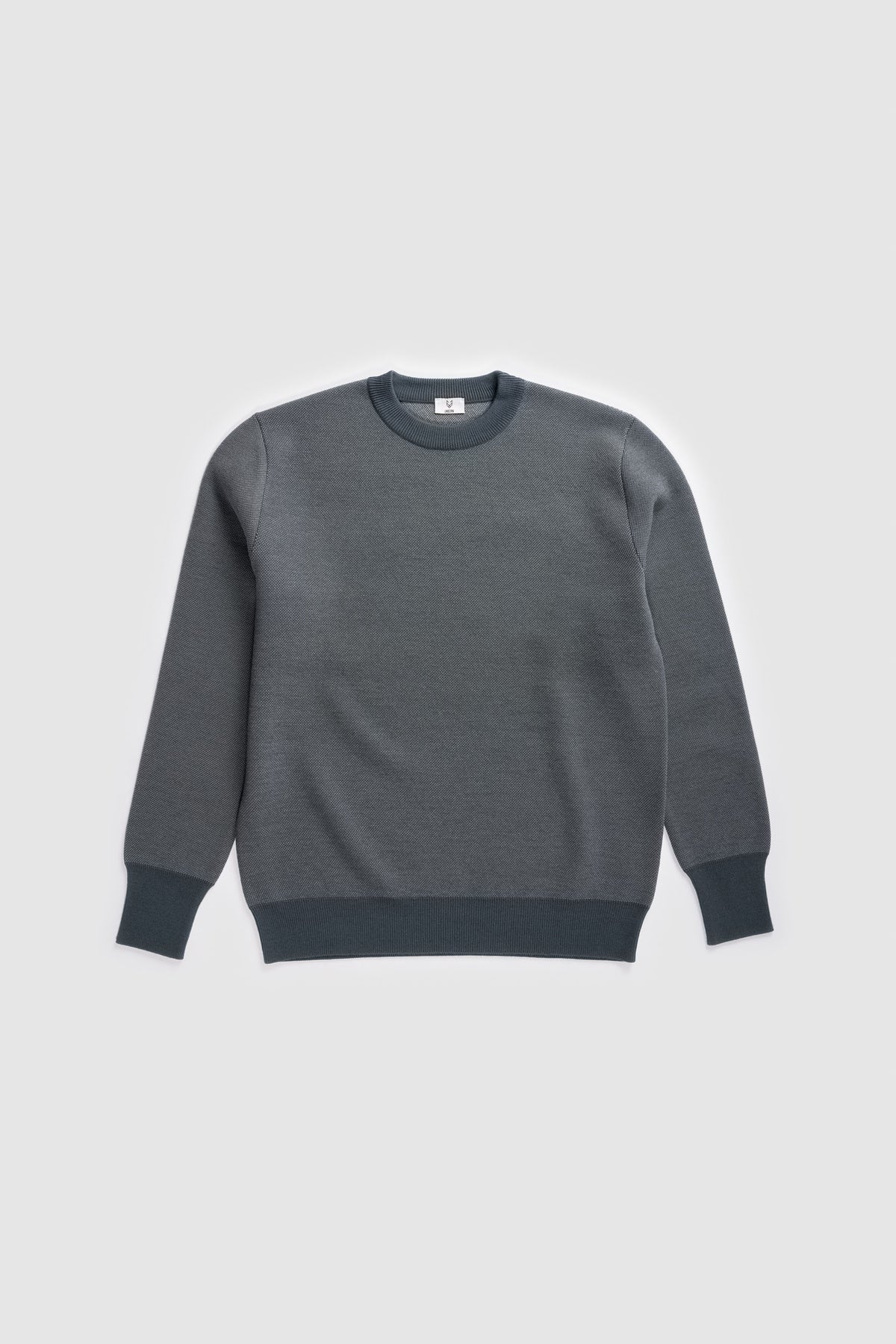 The Merino wool jaquard sweater Navy Grey, flat front - Unborn