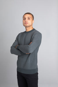 Model Wearing The Merino wool jaquard sweater Olive Grey, front - Unborn