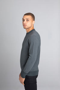 Model Wearing The Merino wool jaquard sweater Navy Grey, left - Unborn