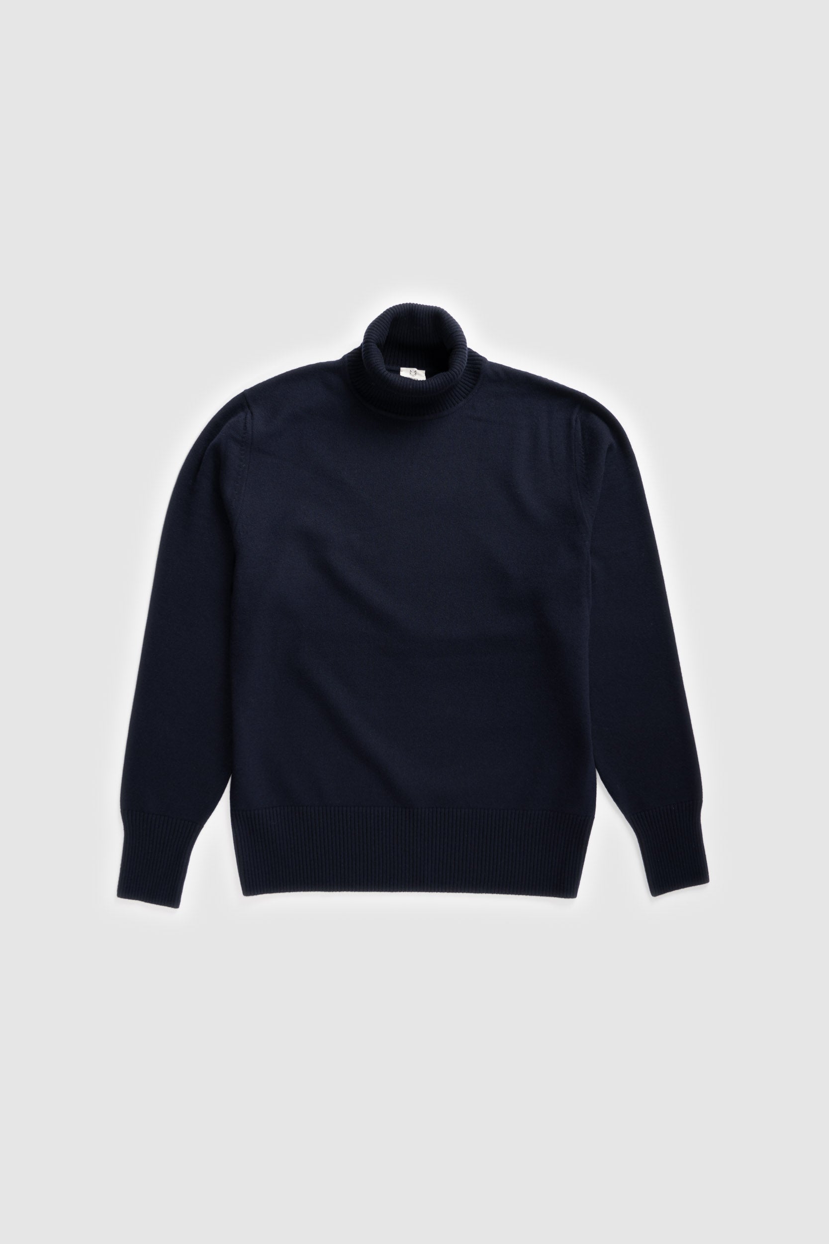 The Merino Wool Roll Neck Navy, flat front - Unborn