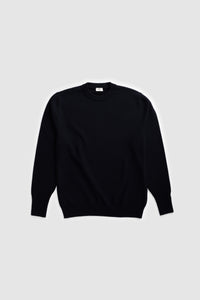 Model wearing The Merino Wool Sweater Black, flat front  - Unborn