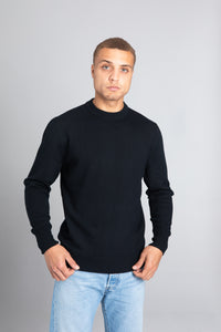 Model wearing The Merino Wool Sweater Black, front - Unborn