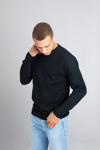 Model wearing The Merino Wool Sweater Black, front - Unborn