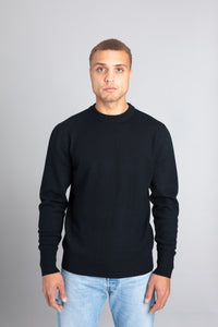 Model wearing The Merino Wool Sweater Black, front - Unborn