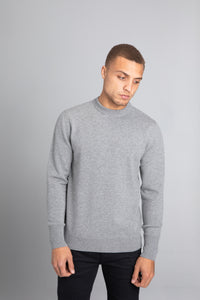 Model wearing The Merino Wool Sweater Grey Melange, front - Unborn
