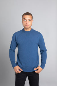 Model wearing The Merino Wool Sweater Sky Blue, front - Unborn