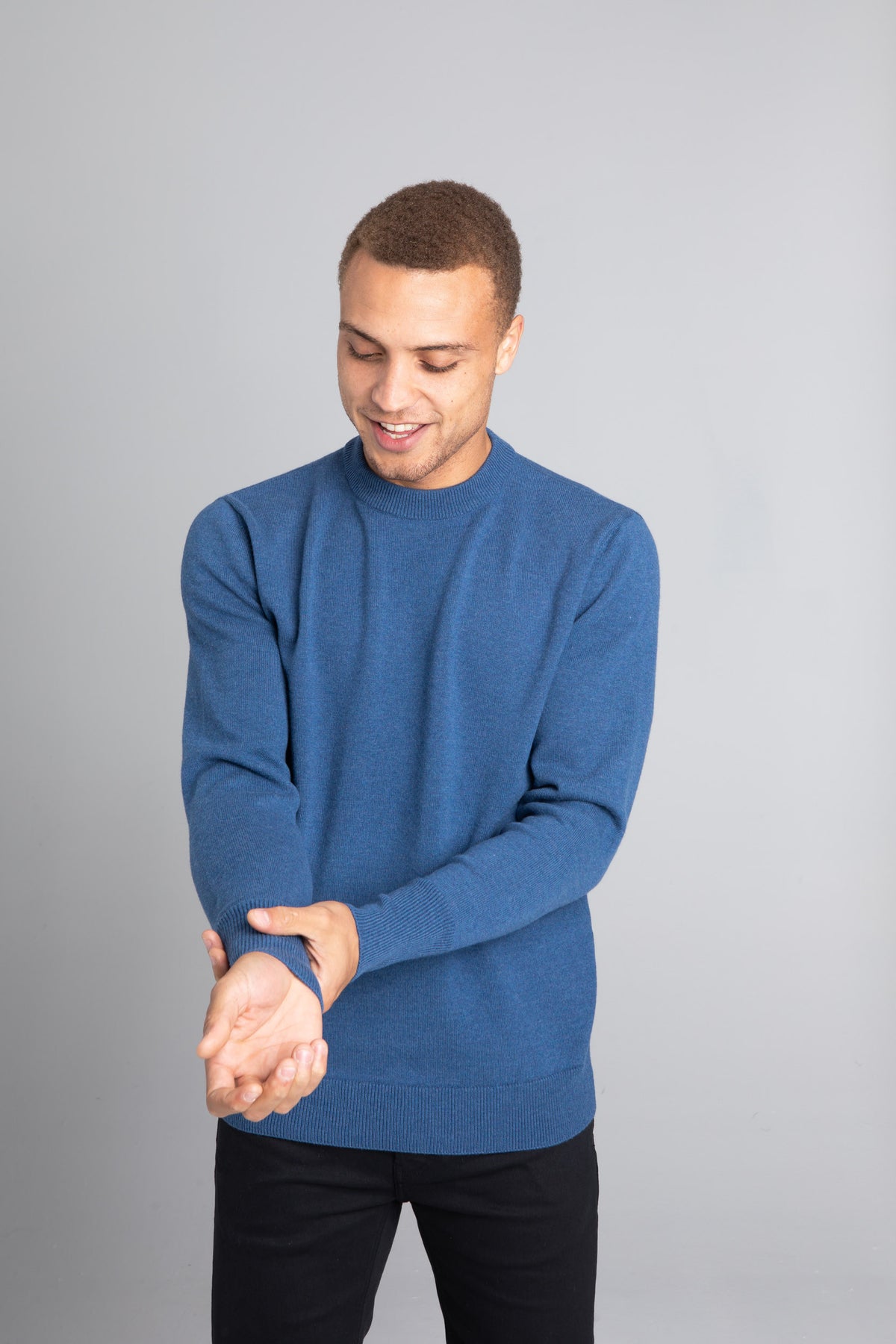Model wearing The Merino Wool Sweater Sky Blue, front - Unborn