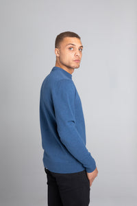 Model wearing The Merino Wool Sweater Sky Blue, back - Unborn